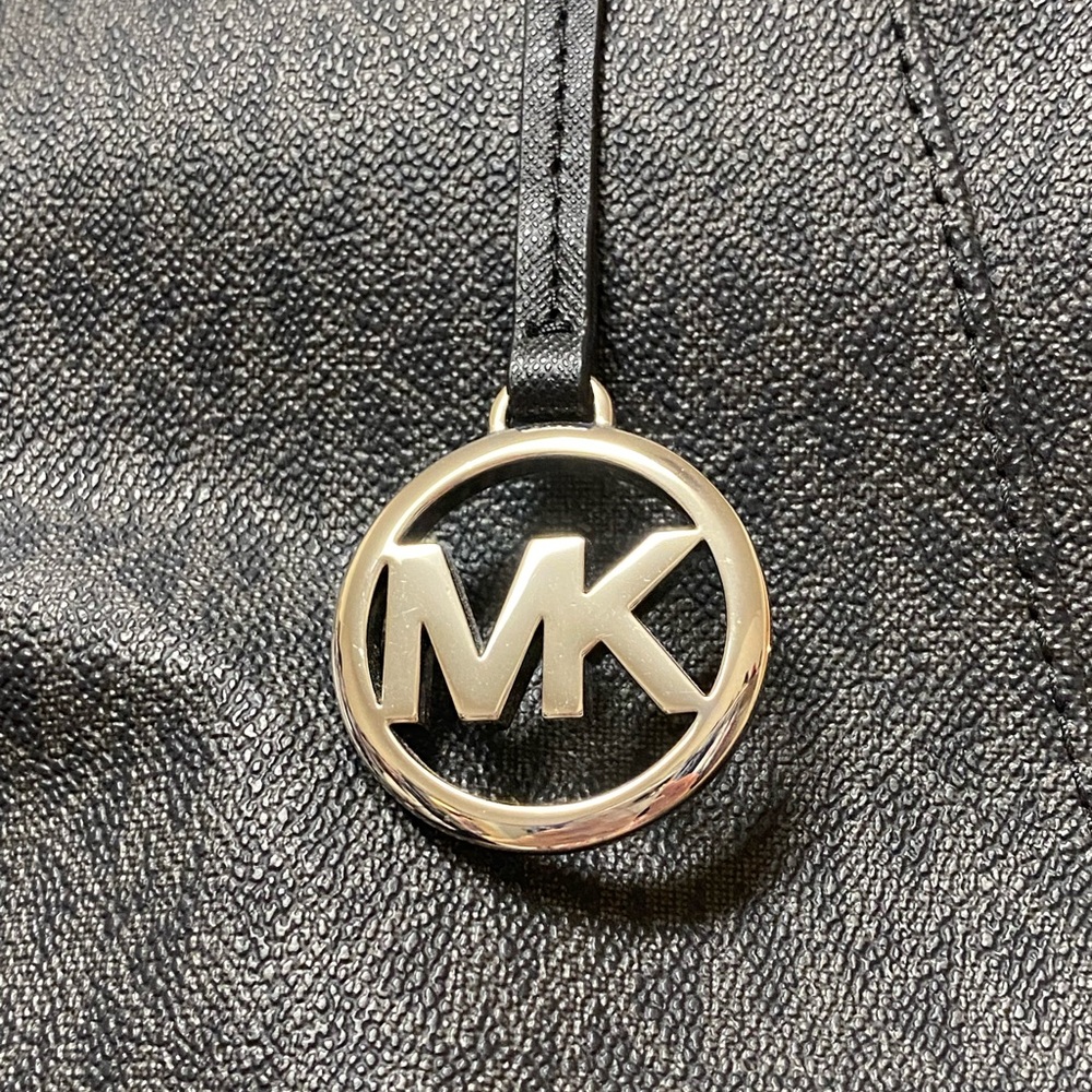 Michael Kors black and gray purse.